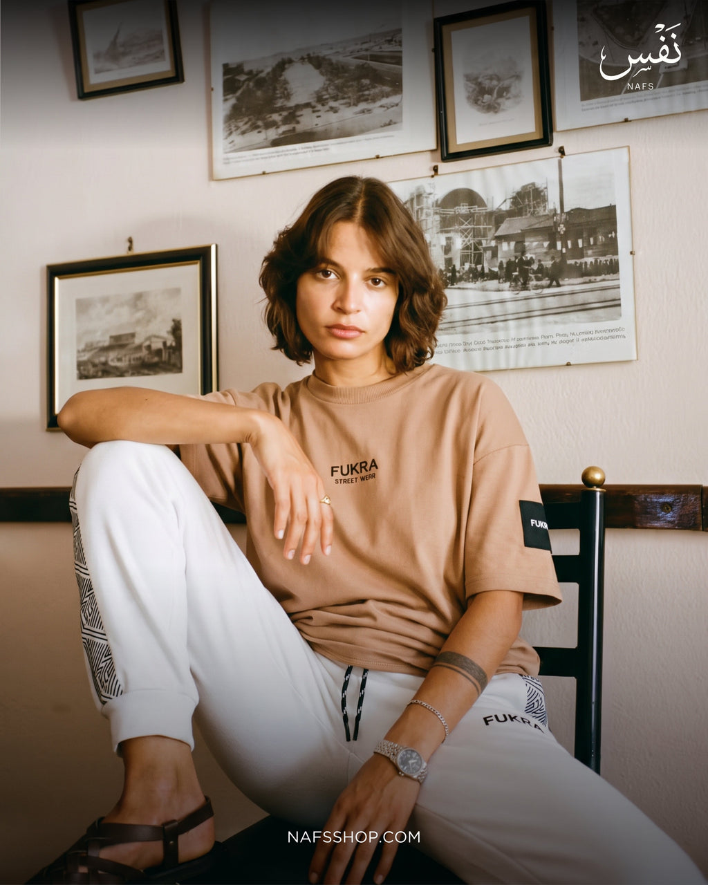The Quiet Tee — Camel, seated portrait