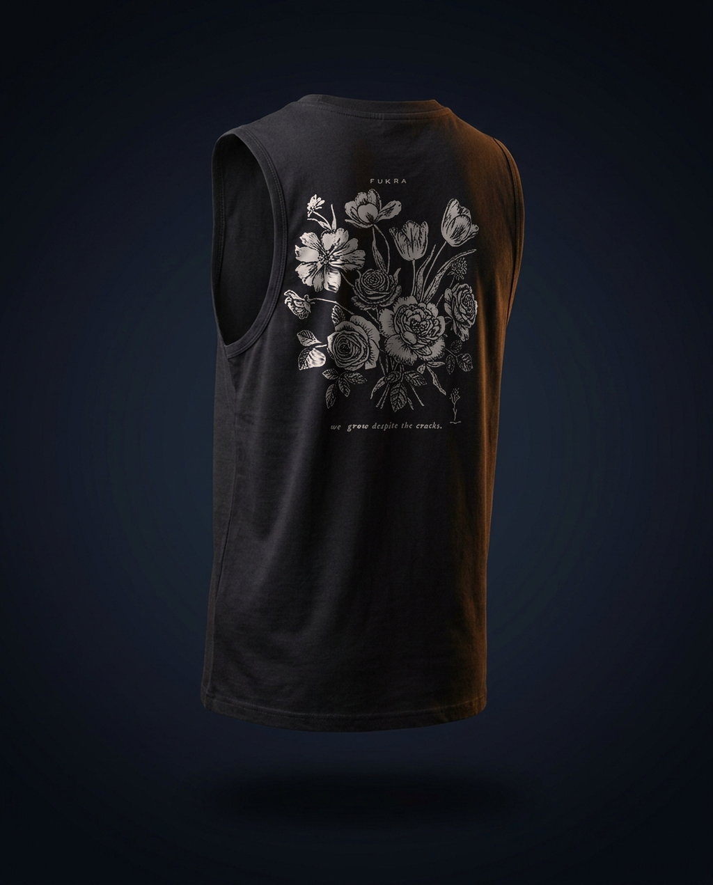 Crescent Tank — Ink, ghost-mannequin back view: the FUKRA bouquet print with the line we grow despite the cracks