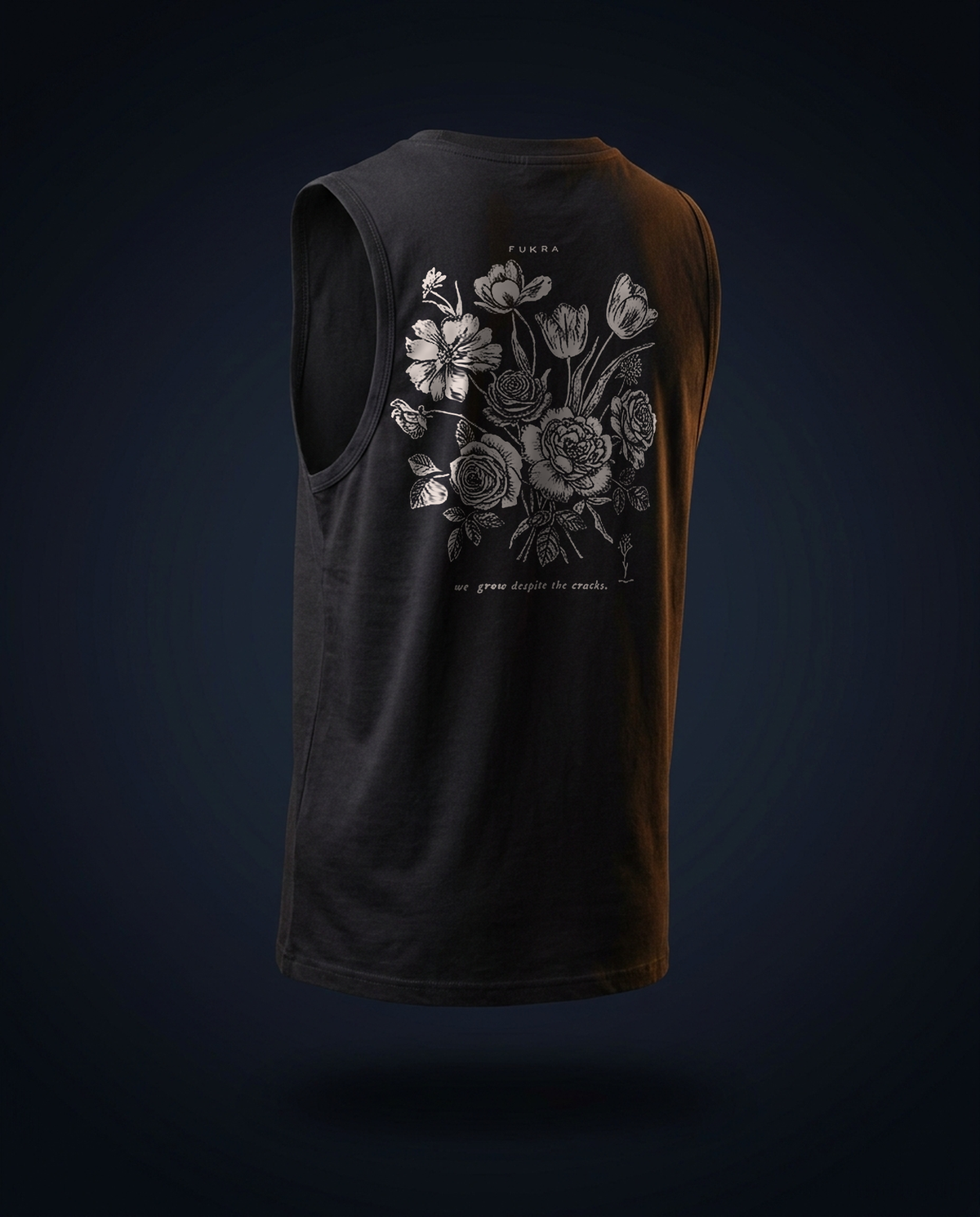 Crescent Tank — Ink, ghost-mannequin back view: the FUKRA bouquet print with the line we grow despite the cracks