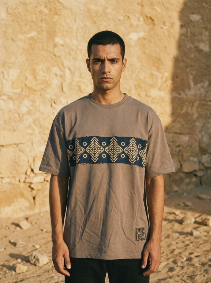Ornament Patch Tee — limestone wall film, woven chest band